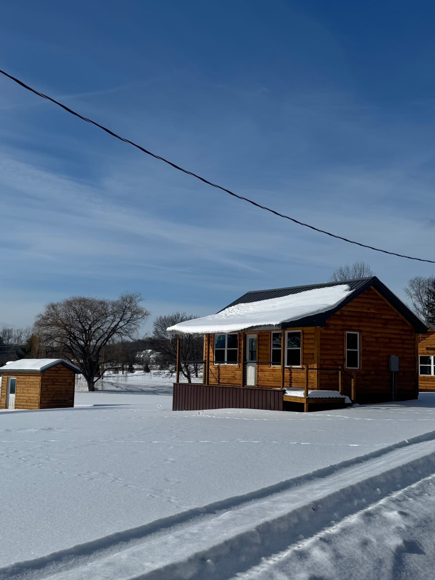 Cabin exterior under a clear winter sky